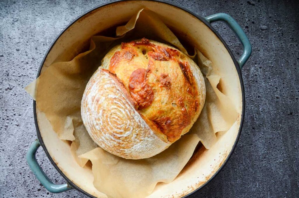 baked sourdough pepperoni bread in a Dutch oven