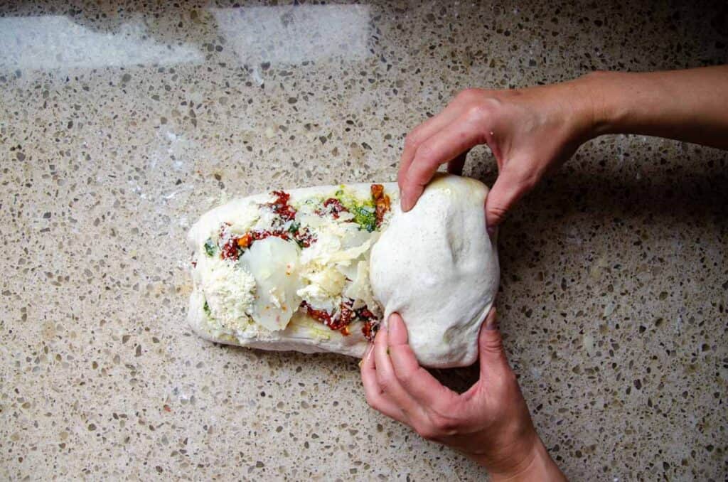 rolling the inclusions into the dough