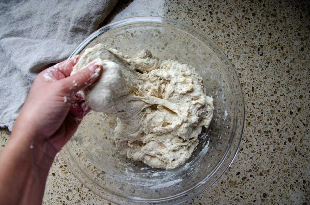 stretching the sourdough pesto sun dried tomato bread dough