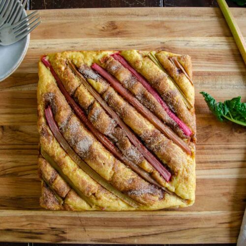 Rhubarb cake on wooden cutting board