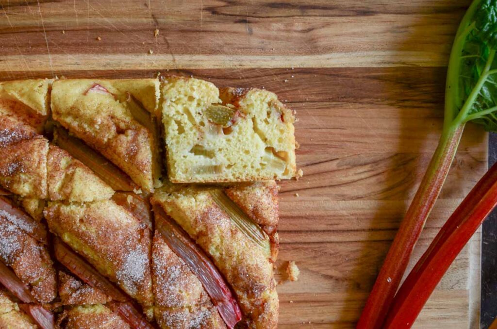 Cross section of rhubarb cake on wood board