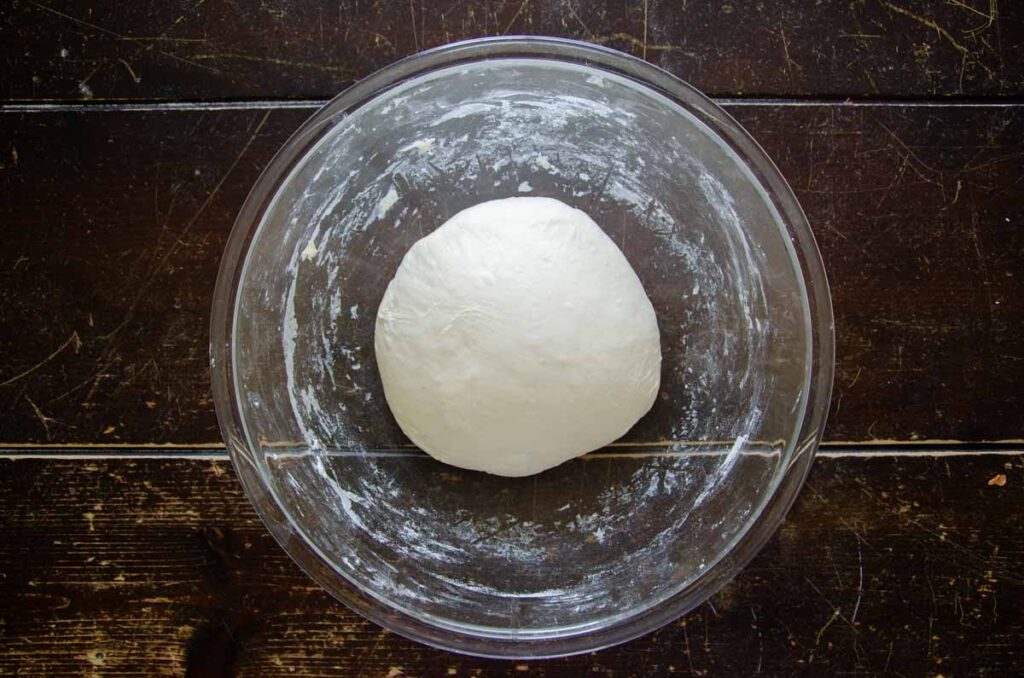 Resting dough in glass bowl
