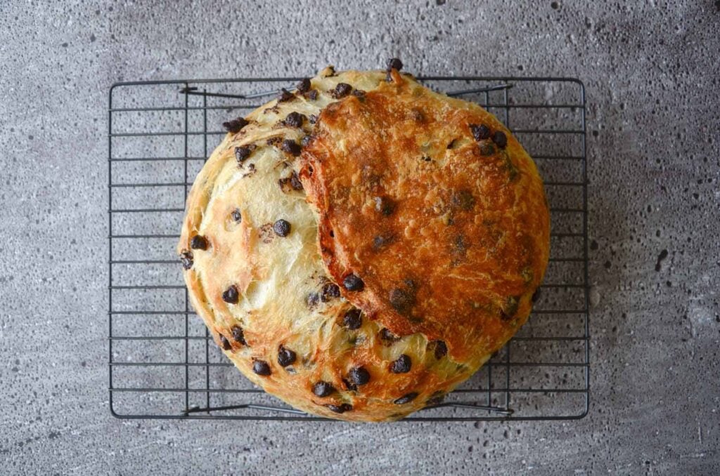 Chocolate chip sourdough croissant bread on cooling rack