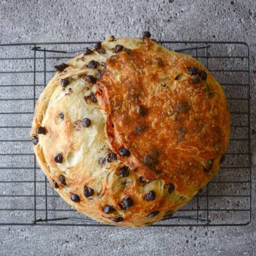 Chocolate chip sourdough croissant bread on cooling rack