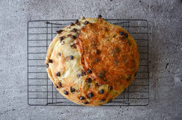 Chocolate chip sourdough croissant bread on cooling rack