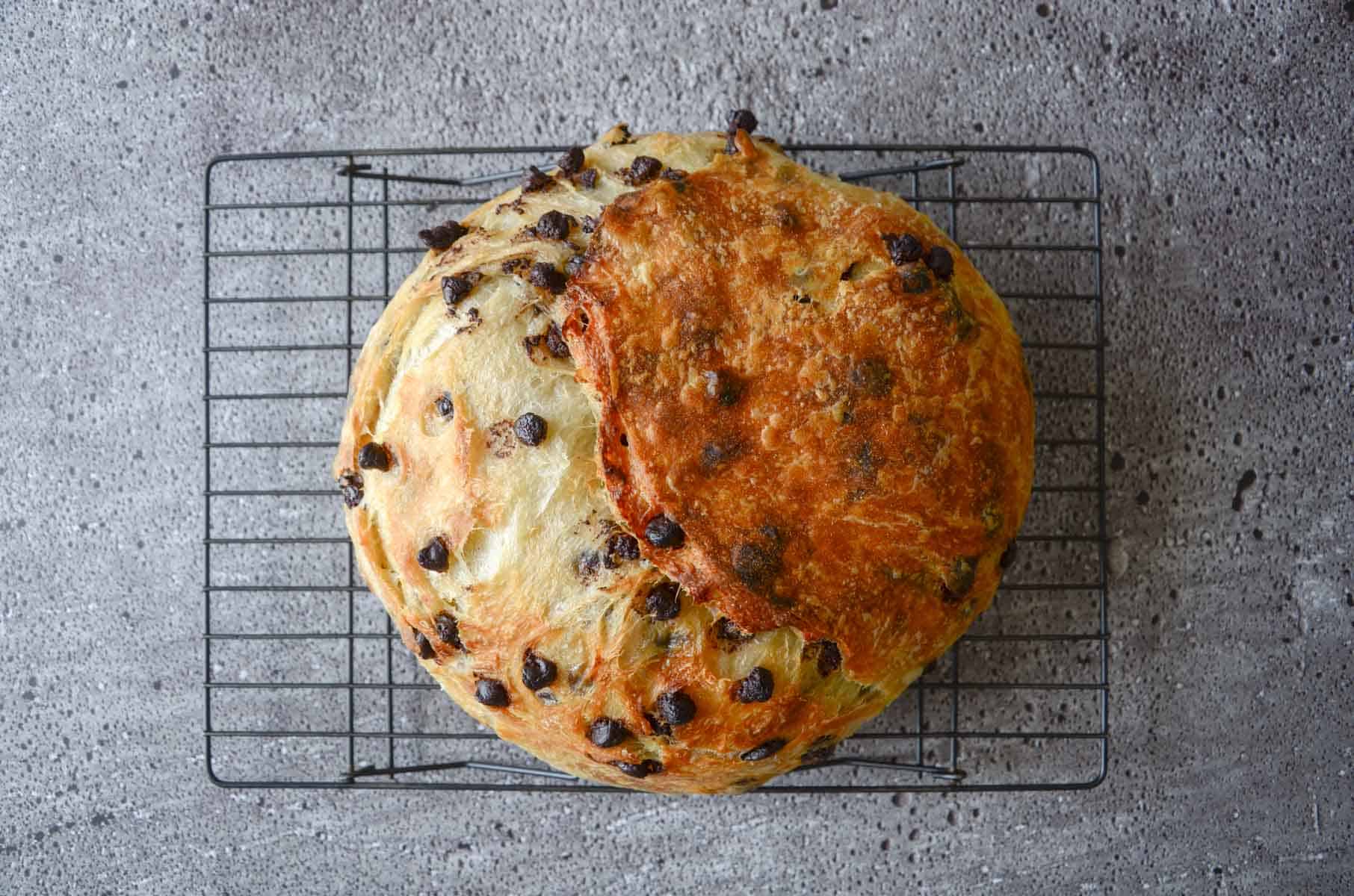 Chocolate chip sourdough croissant bread on cooling rack