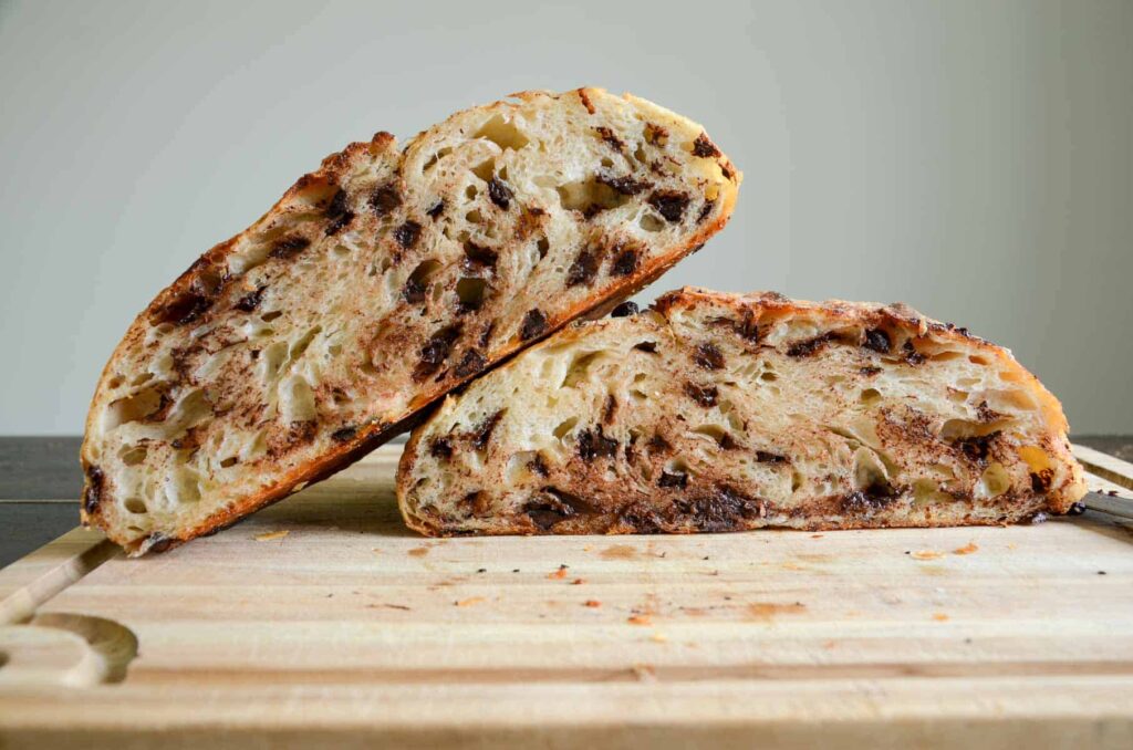 sourdough chocolate chip croissant bread on wood board