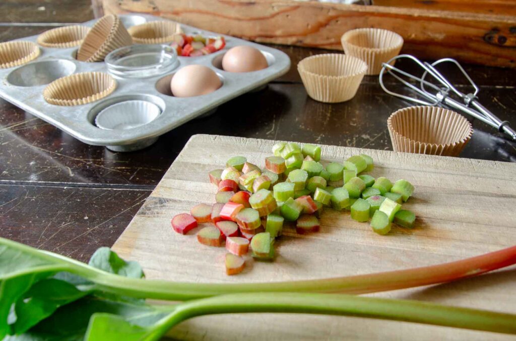 Rhubarb stalks on wooden cutting board