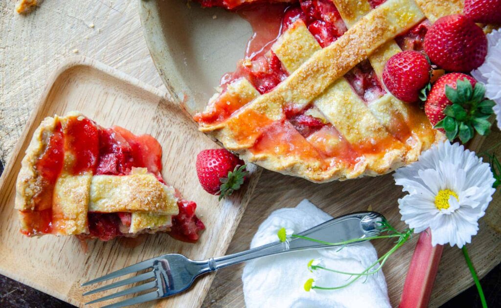 A slice of strawberry rhubarb pie on a plate
