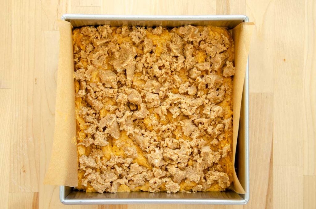 the bottom layers of sourdough pumpkin coffee cake in a pan