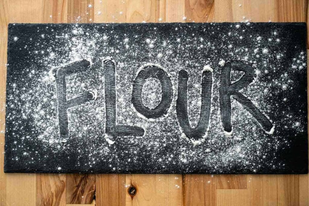 'flour' spelled out on a piece of black slate 