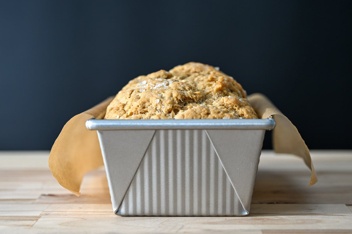 sourdough beer bread in a metal loaf pan