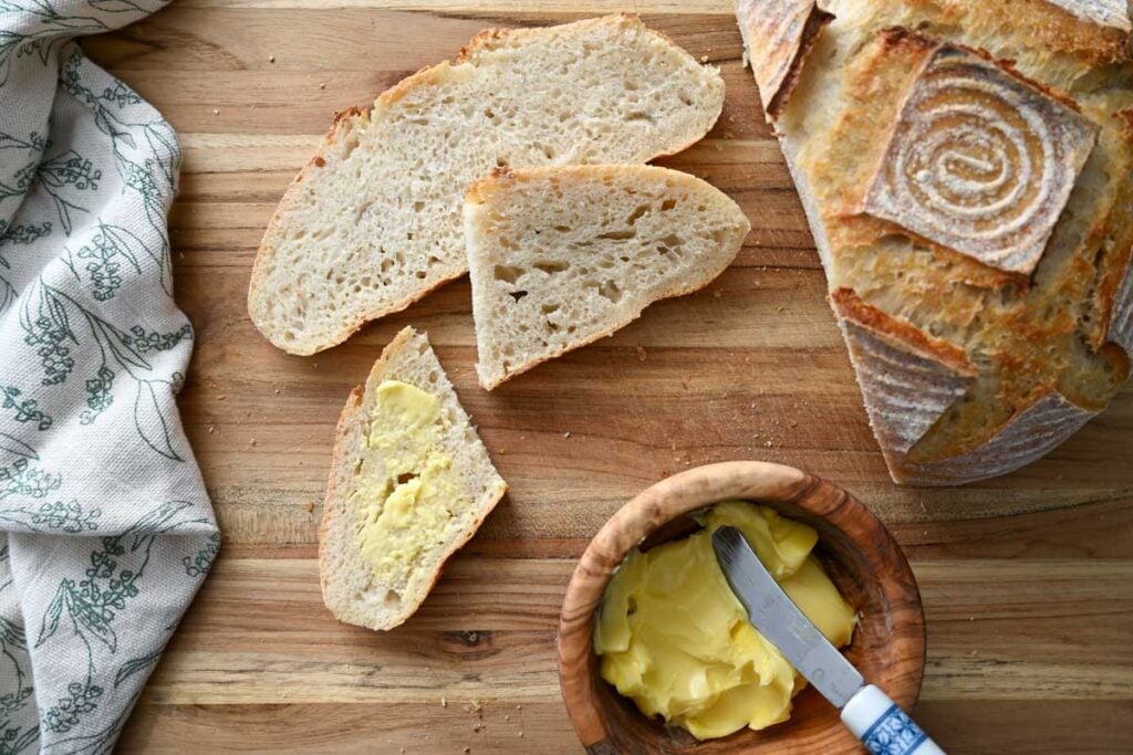 no knead sourdough bread slices with butter