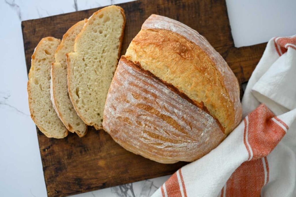 sourdough discard bread sliced on a wooden board