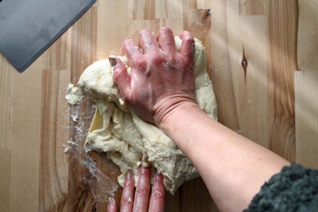 kneading butter into sourdough pretzel dough 