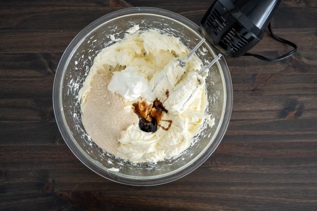 the remaining easy cheesecake filling ingredients in a glass bowl