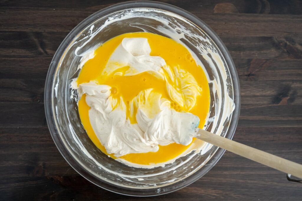 folding beaten eggs into easy cheesecake filling 