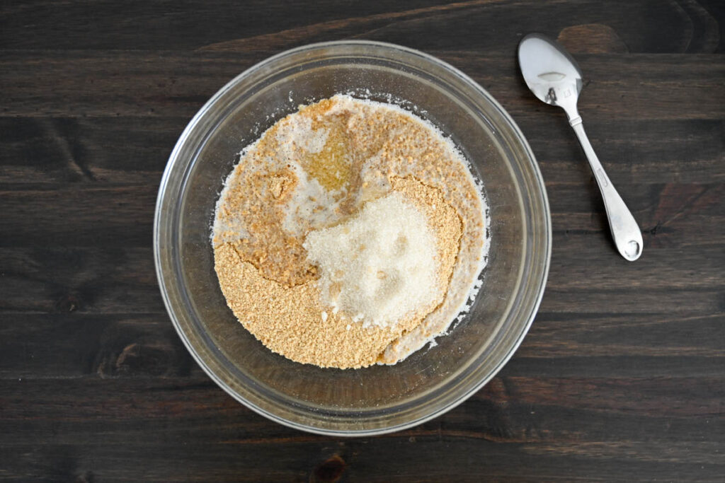 easy cheesecake graham cracker crust ingredients in a glass bowl