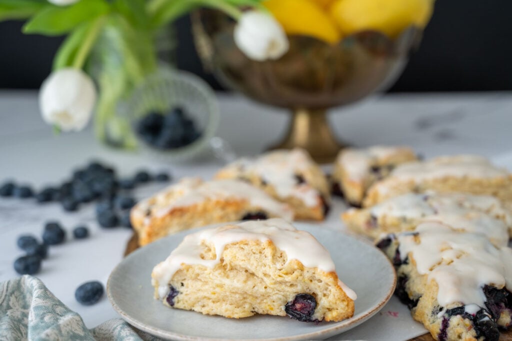 A sourdough lemon blueberry scone on a plate