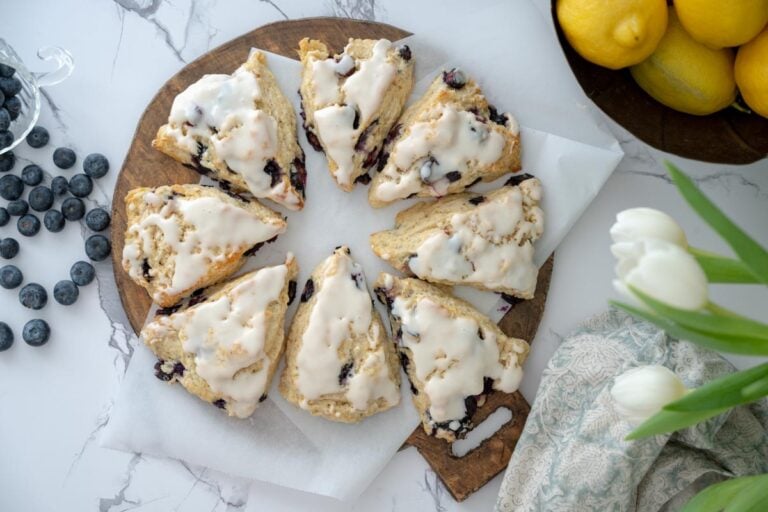 lemon blueberry sourdough scones on a wooden board