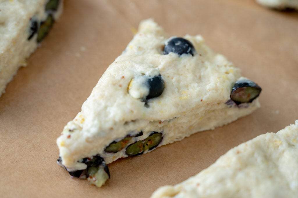 unbaked lemon blueberry sourdough scone dough on baking sheet