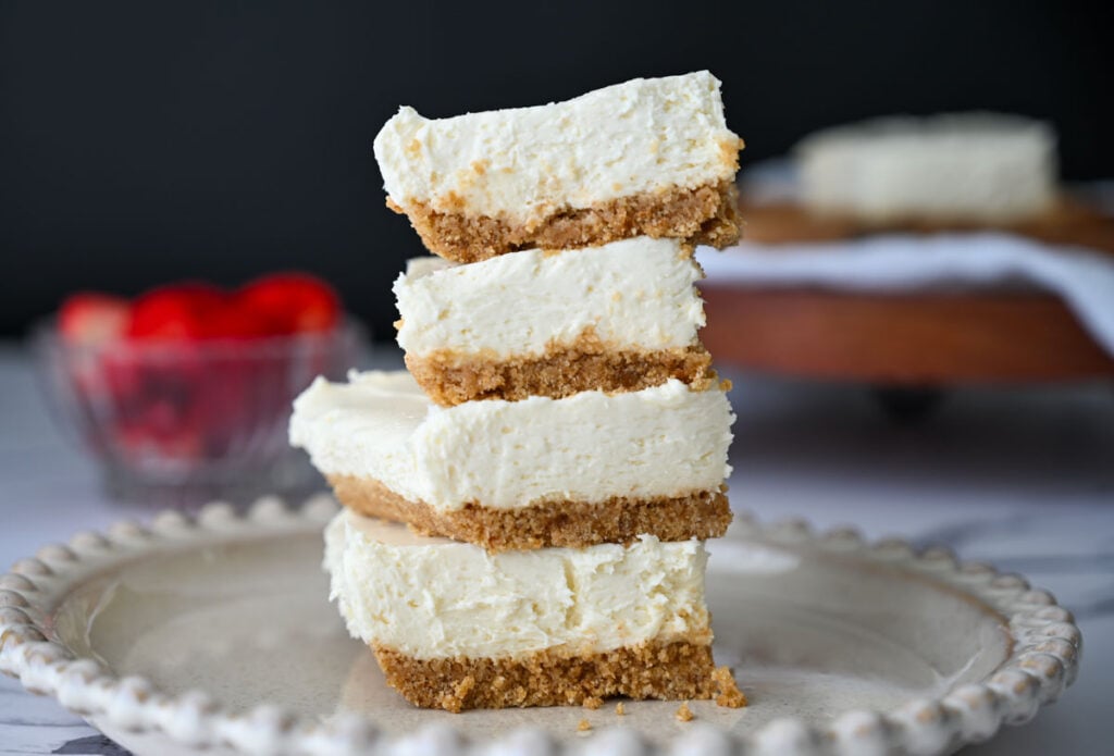 no bake cheesecake pieces stacked on a plate