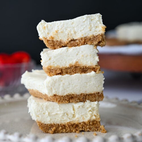 no bake cheesecake pieces stacked on a plate