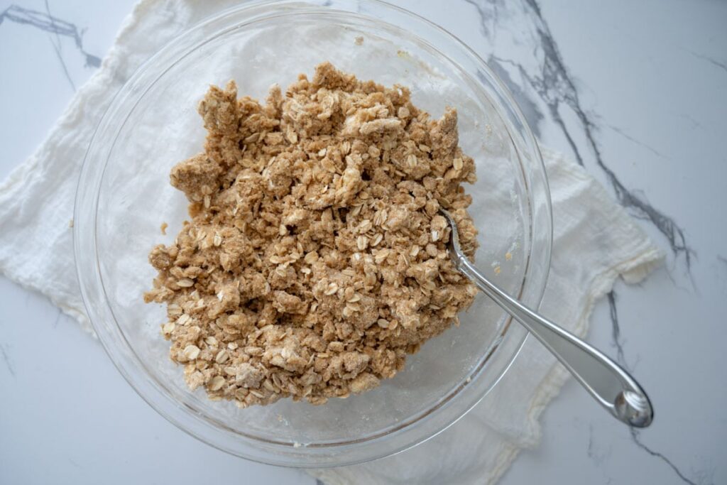 crumble mixture for rhubarb crumble bars in a glass bowl