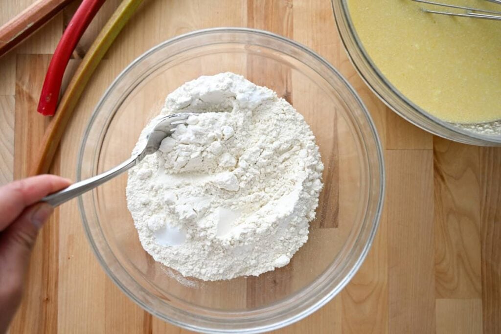combining sourdough rhubarb bread
 dry ingredients in a glass bowl