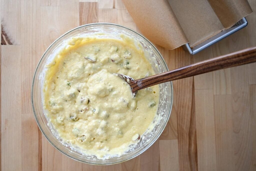 sourdough rhubarb bread batter in a glass bowl
