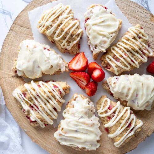 sourdough strawberry scones arranged on a wooden platter