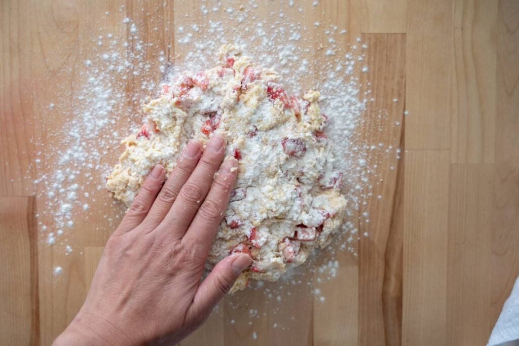 patting out sourdough strawberry scone dough