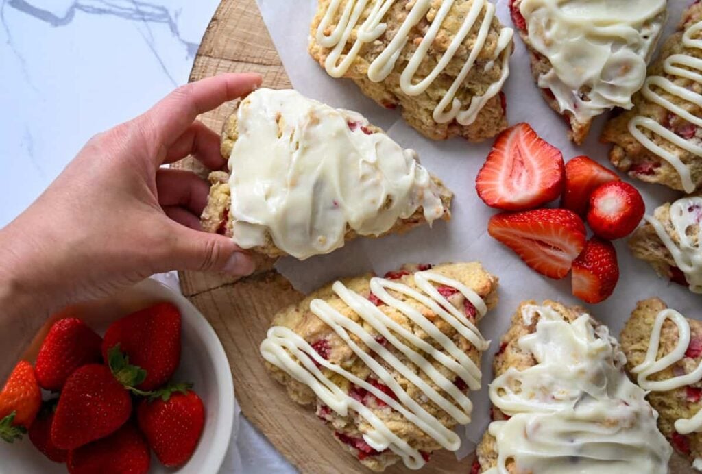 holding a sourdough strawberry scone