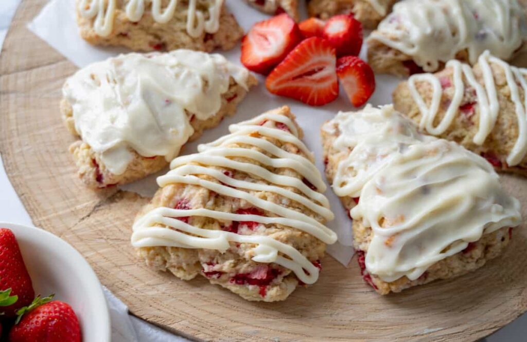 sourdough strawberry scones on a wood platter