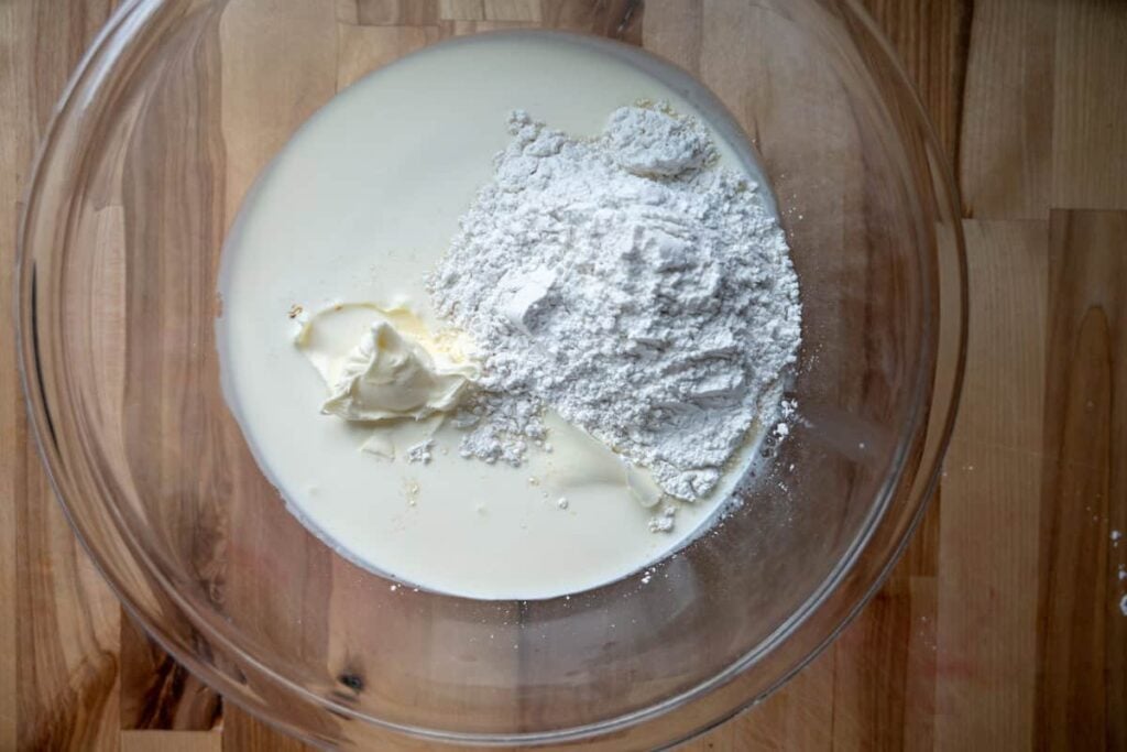 whipped cream ingredients in a glass bowl