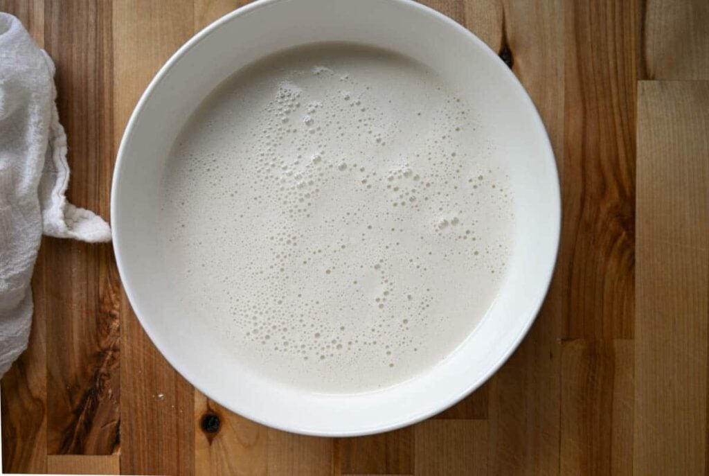 the sourdough shortcake wet ingredients in a glass bowl