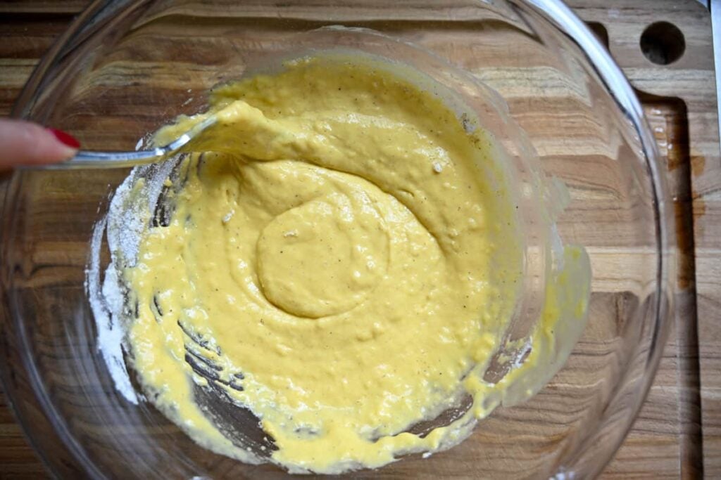 sourdough zucchini batter in a large glass mixing bowl