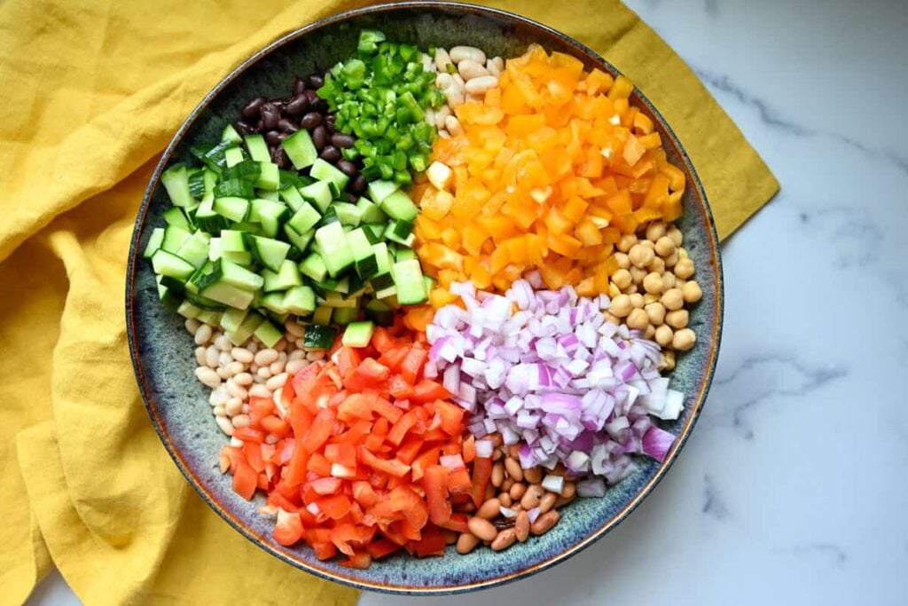a bowl of beans and diced fresh vegetables