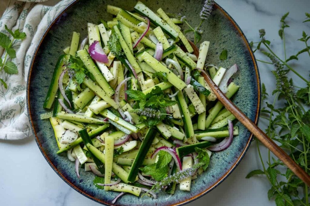 cucumber zucchini salad in a large bowl 