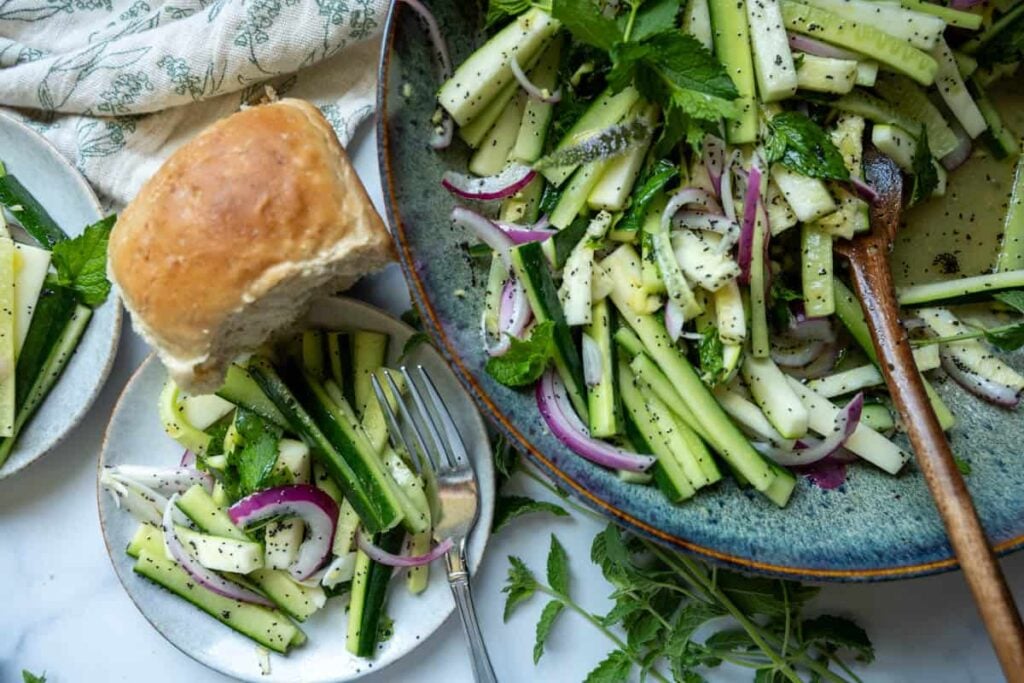 cucumber zucchini salad and small dinner roll