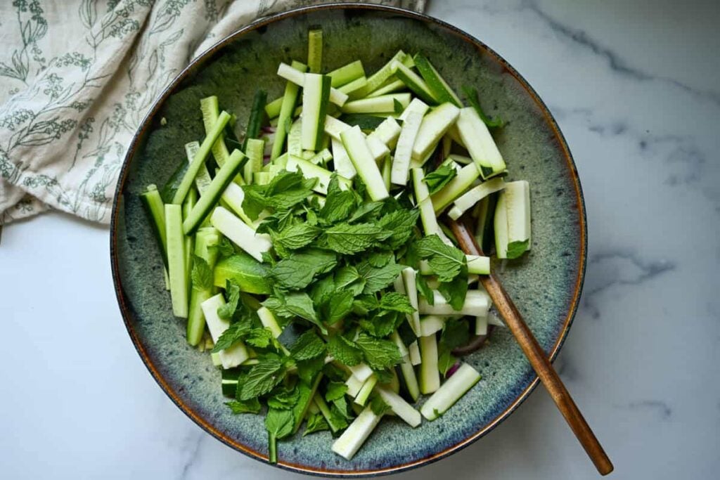 cucumber zucchini salad in a large bowl