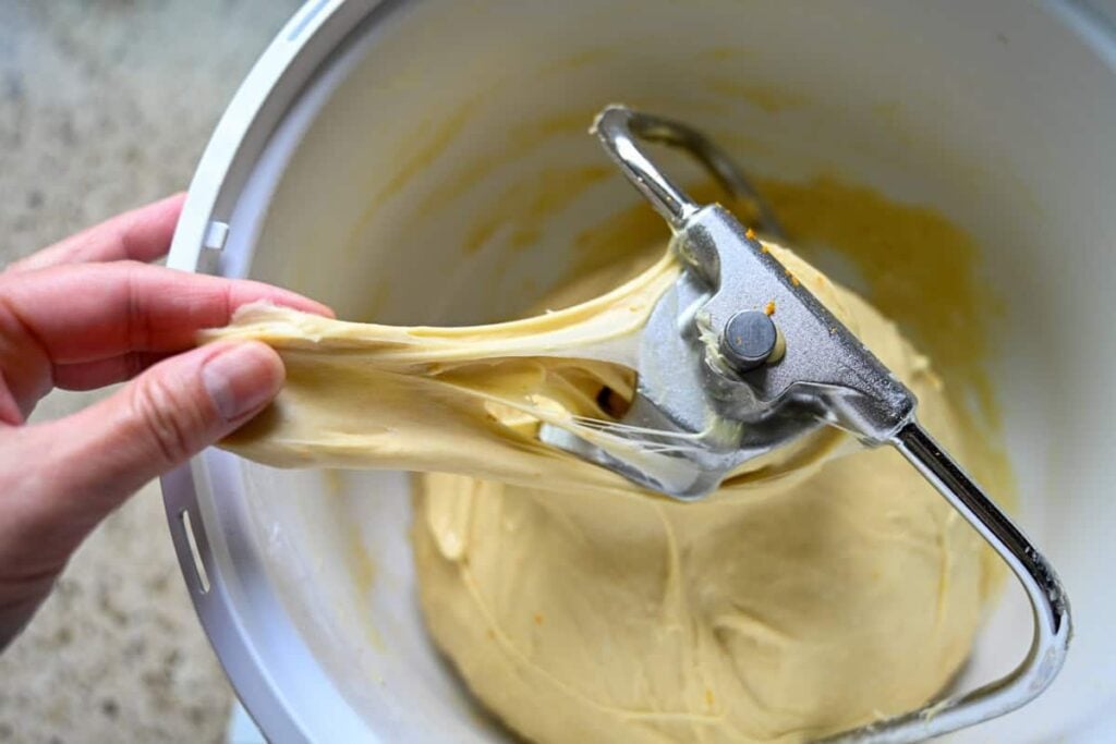 stretching the panettone dough in a stand mixer