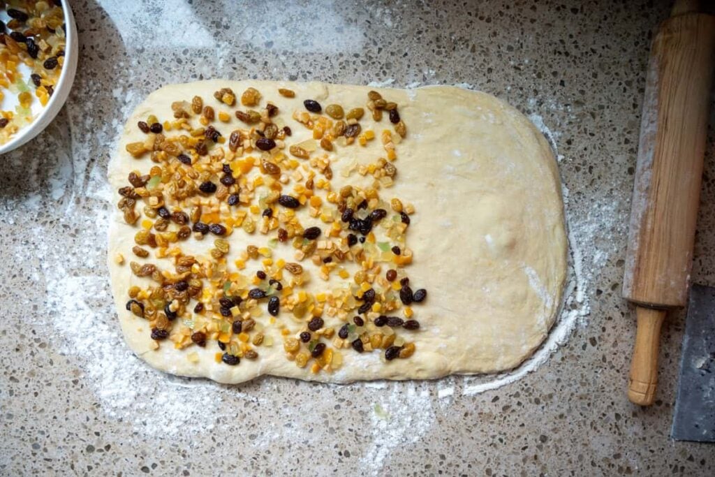 adding dried fruit sourdough panettone bread dough