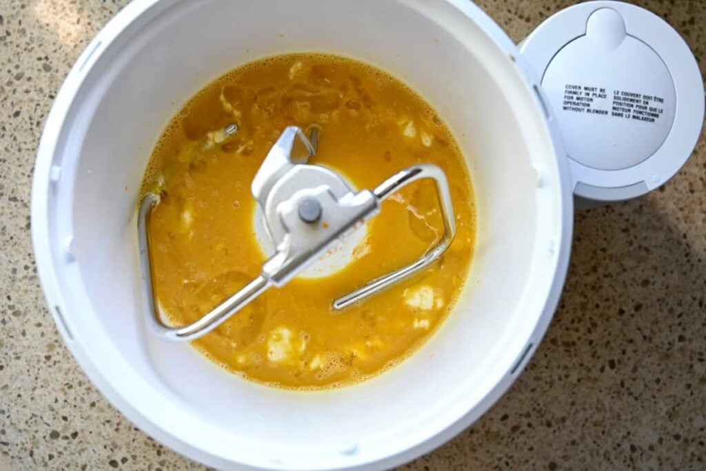 the wet ingredients for sourdough panettone in the bowl of a stand mixer