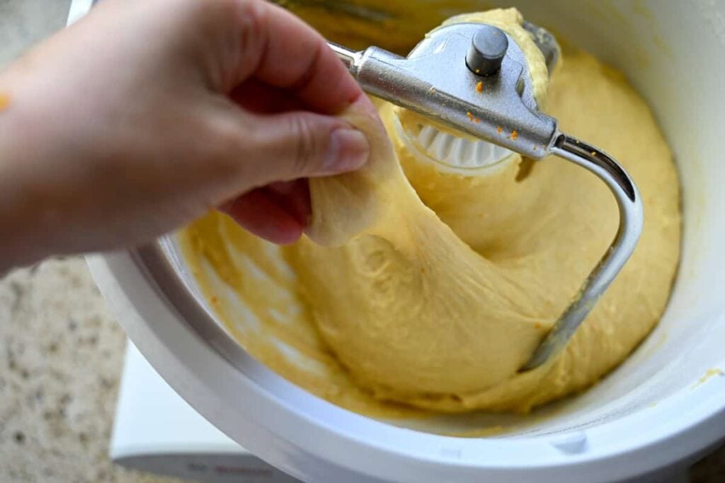 stretching the panettone dough in a stand mixer