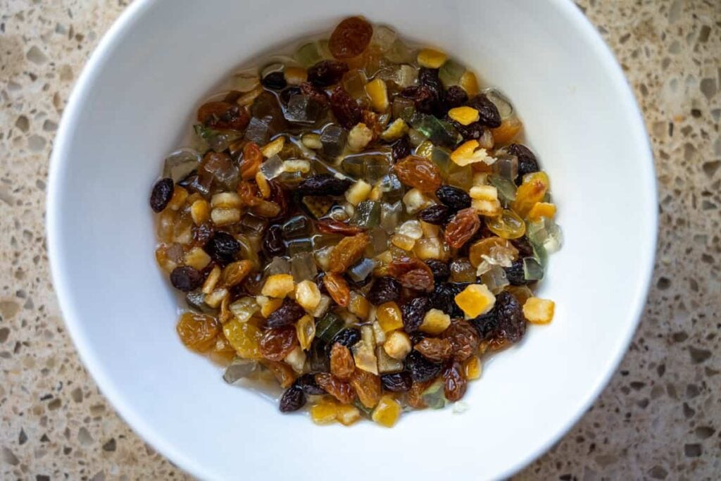 soaking dried fruit in a white bowl