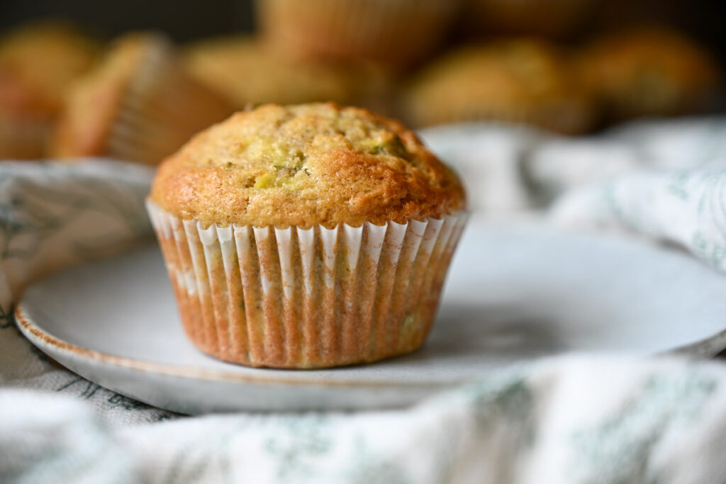 a sourdough zucchini muffin on a plate